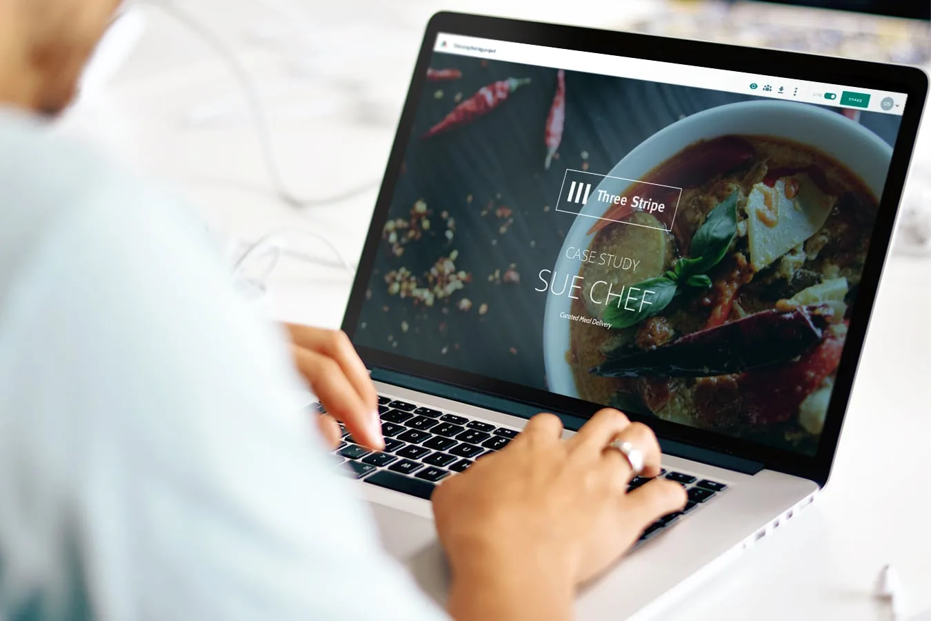 A colourful business website displayed on a laptop