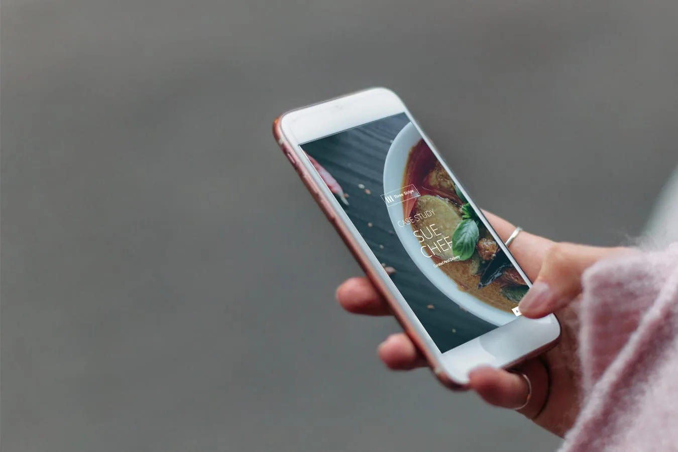 A person exploring a colourful website on their phone